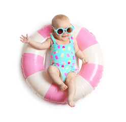 Cute little baby with sunglasses on inflatable ring against white background, top view
