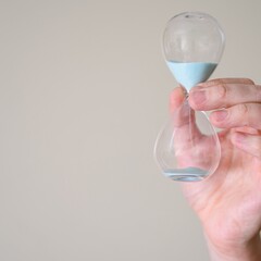 The picture shows someone measuring using a shot glass