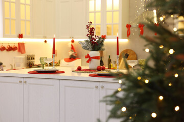 Christmas decor and tableware on countertop in kitchen. Interior design