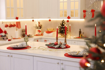Christmas decor and tableware on countertop in kitchen. Interior design