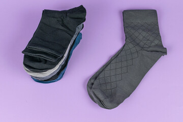 Variety of Socks on Purple Background: Fashion, Style, and Comfort