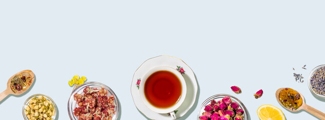 Herbal Tea Composition With Natural Ingredients On Light Blue Background. Concept of Healthy Lifestyle, Organic Nutrition, Alternative Medicine, and Wellness Content For Food And Health Brands