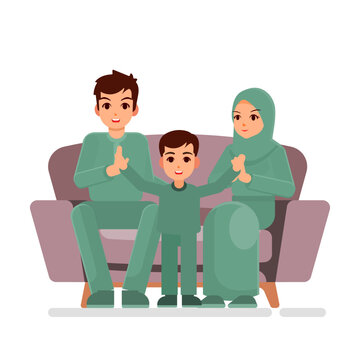 Happy family consist of father mother and son, welcome Eid al Fitr, family sit together in sofa
