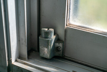 Close-Up of Rusty Window Latch Mechanism
