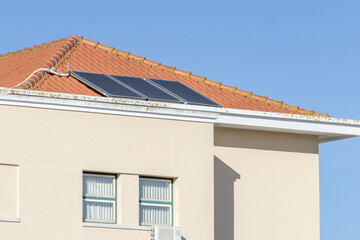 Obraz premium Solar panels on house roof generating green energy