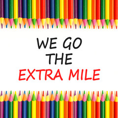 Support, help we go the extra mile symbol. Concept words We go the extra mile on beautiful white paper. Beautiful white background. Colored pencils. Business we go the extra mile concept. Copy space.