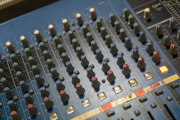 Close-up of Audio Mixer Controls and Knobs