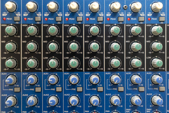 Audio Mixer Control Panel with Knobs and Faders