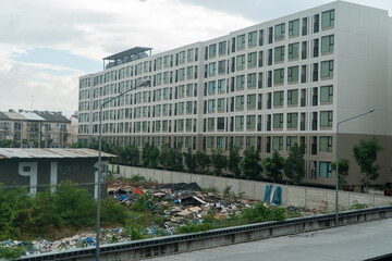 Obraz premium Urban Landscape with Abandoned Buildings and Waste