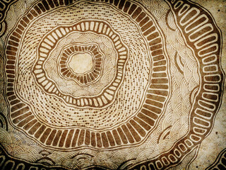 Abstract grunge background with hand drawn concentric circles and organic tribal patterns on old paper texture