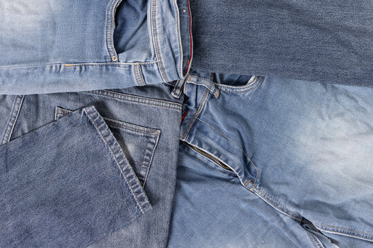 Denim jeans abstract background showing textile waste and fast fashion problems. Full frame