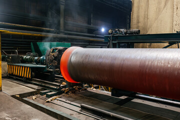 Iron pipe centrifugal pipe casting, new red hot freshly cast iron pipe at the foundry