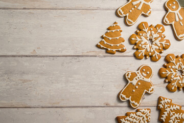 Holiday background. Christmas gingerbread cookies with icing flat lay, festive food, copy space