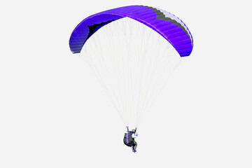The sportsman flying on a paraglider. Beautiful paraglider in flight on isolated white background.