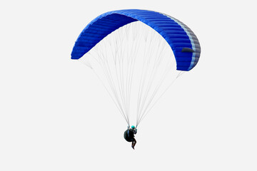 Fototapeta premium The sportsman flying on a paraglider. Beautiful paraglider in flight on isolated white background.