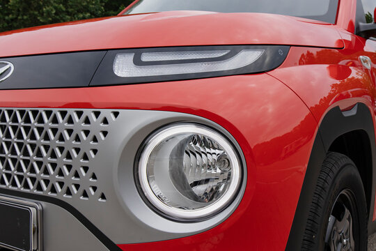 June 10, 2022, Seoul, South Korea - Close-up of the headlight and grille of a red Hyundai Casper.