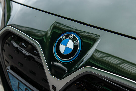 June 5, 2022, Seoul, South Korea - Close-up of the BMW logo on the front of a dark green BMW i4 electric vehicle.