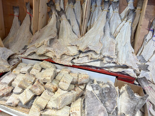 Traditional dried cod fish known as bacalhau, for sale in a Portuguese fish market. Typical food from Portugal.