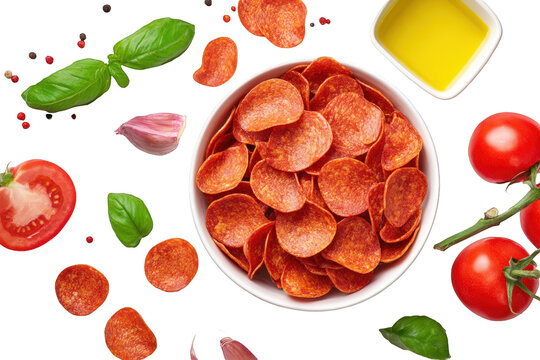 Pepperoni slices in bowl with ingredients tomatoes, basil leaves, garlic, olive oil for pizza Isolated On Transparent Background