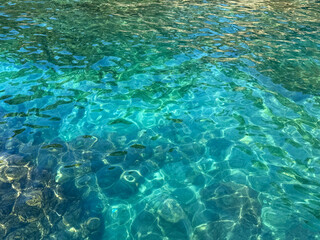 Emerald transparent sea water surface.