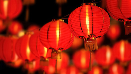 Traditional red Chinese lanterns glowing at night, creating a warm festive atmosphere for Lunar New Year celebrations, symbolizing luck, prosperity, and cultural heritage