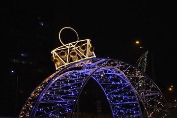Christmas decoration on the streets in snow at night