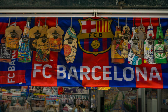 Barcelona, Spain, Europe - Nov 22, 2025: fc barcelona soccer team flag banner bottle opener souvenir merchandise store display fan concept of sport, marketing, commerce