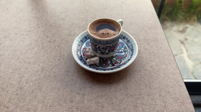 Traditional Turkish Coffee and Lokum on Table by Window
