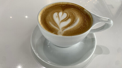 Top View of Latte Art Coffee Cup on White Table