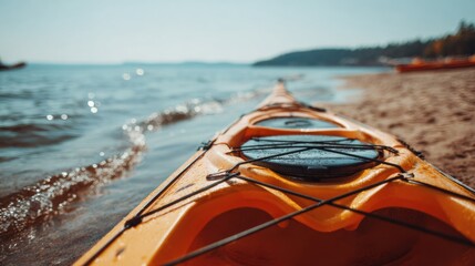 Kayak Rests on Sandy Beach With Blur of Sea and Clear Sky Behind, Ready for Adventure in Warm Daylight Hours