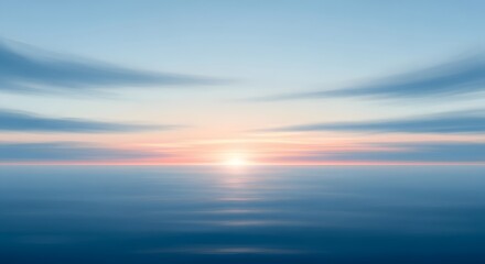 A tranquil ocean scene at sunrise with blurred clouds reflecting on the calm water