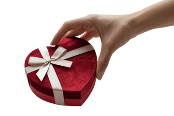 Single hand holding elegant red heart-shaped gift box tied with white ribbon, representing love, surprise gifts, valentine's day celebrations