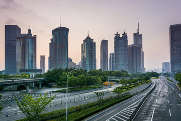 Fototapeta premium Modern Urban Skyline with Empty Road and Greenery