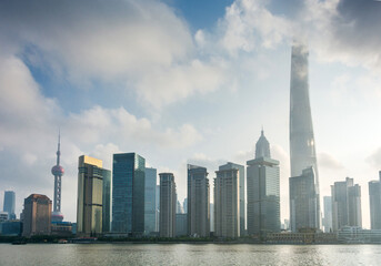 Fototapeta premium Modern Skyscrapers Along the Riverfront in Urban Area
