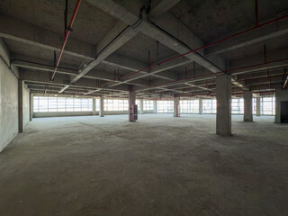 Expansive Empty Industrial Space with Natural Light and Urban Potential