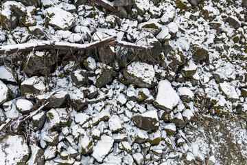 Snowy Rock Pile On Rocky Slope in British Columbia, Canada - Rugged Winter Landscape