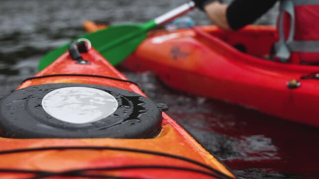 Kayaking in the lake skerries, colorful canoe kayak boat paddling, canoeing in river, scandinavian landscape, group of tourists athletes in kayaks floating, kayakers rowing during water sports tour