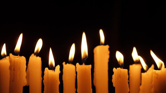 Candles Glow Softly, Participants Quietly Ignite Candles Together, Silent Gathering Illuminated By Flickering Candle Flames, Mourners Form Peaceful Assembly Around Glowing Candlelights