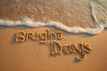 Bright Days Neatly Written in Ultra-Clear Letters on Reflective Wet Sand with Golden Sun and Peach Glow &ndash; good for banner design