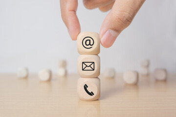 Contact us concept with wood block and symbols
