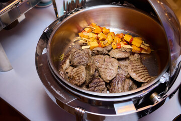 Meaty vegetable stir-fry, Cast iron skillet filled with savory beef and vegetables, Delicious and rustic beef and vegetable dish cooked to perfection in cast iron skillet