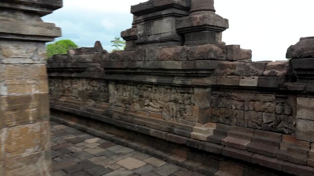 Walking around the Buddist temple Borobudur near Yogyakarta city, Central Java, Indonesia. World famous landmark in Indonesia.