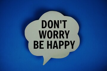Don't Worry Be Happy text with speech bubble top view on blue background