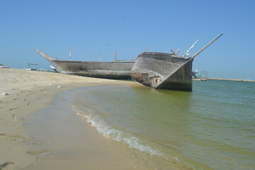 An old, broken boat looks out to sea. Hope slowly dies with it. Foggy future. 