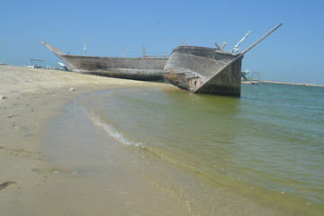 An old, broken boat looks out to sea. Hope slowly dies with it. Foggy future. 