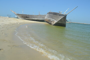 An old, broken boat looks out to sea. Hope slowly dies with it. Foggy future. 