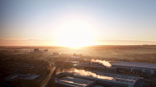 Golden Morning Light Over Basingstoke City With Mist and Smoke