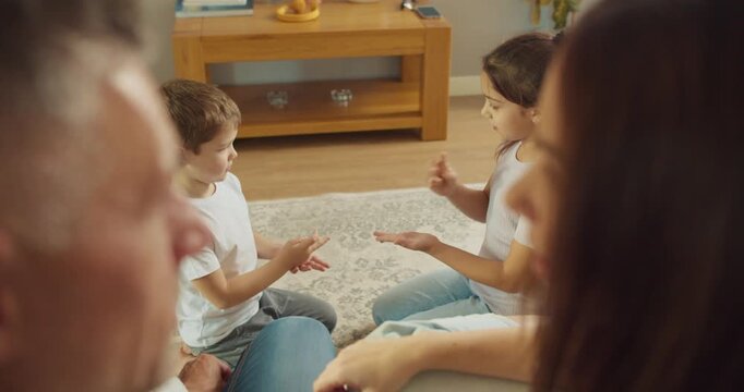 grandparents watching grandchildren play clapping game