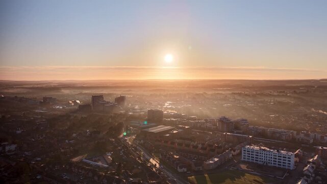 Golden Morning Light Over Basingstoke City With Mist and Smoke