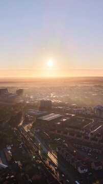 Golden Morning Light Over Basingstoke City With Mist and Smoke